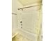Clean white bathtub and shower combination with built-in shelving at 5599 Wheeler Ridge Rd, Auburn, GA 30011