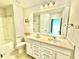 Bright bathroom with double sinks, large mirror, and tile flooring at 5599 Wheeler Ridge Rd, Auburn, GA 30011