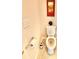 Powder room featuring a toilet, art, and fixtures at 5599 Wheeler Ridge Rd, Auburn, GA 30011