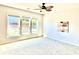 Bright, carpeted bedroom with large windows providing ample natural light and backyard views at 5599 Wheeler Ridge Rd, Auburn, GA 30011