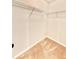 Walk-in closet featuring carpet floors and shelving at 5599 Wheeler Ridge Rd, Auburn, GA 30011