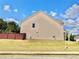 Side view of the house with a well-maintained lawn at 5599 Wheeler Ridge Rd, Auburn, GA 30011