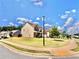 Well-maintained lawn with beautiful landscaping and neighborhood street view at 5599 Wheeler Ridge Rd, Auburn, GA 30011