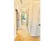 Hallway with neutral walls and carpet leads to other rooms of the home at 5599 Wheeler Ridge Rd, Auburn, GA 30011