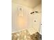 Bright laundry room with overhead shelving and tile flooring at 5599 Wheeler Ridge Rd, Auburn, GA 30011