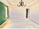 Living room featuring neutral walls, carpet, and a modern chandelier fixture at 5599 Wheeler Ridge Rd, Auburn, GA 30011