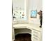 Charming office nook featuring a white countertop, cabinets, and view into the adjacent kitchen at 5599 Wheeler Ridge Rd, Auburn, GA 30011