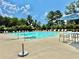 A community pool with lounge chairs and umbrellas offers a relaxing outdoor space at 5599 Wheeler Ridge Rd, Auburn, GA 30011
