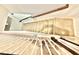 Carpeted staircase with white risers and dark railing at 5599 Wheeler Ridge Rd, Auburn, GA 30011