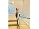 Carpeted staircase with wooden banister leading to the lower level at 5599 Wheeler Ridge Rd, Auburn, GA 30011