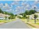 View of a well-maintained street in a residential neighborhood at 5599 Wheeler Ridge Rd, Auburn, GA 30011