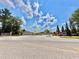 A community street view showcases well-maintained landscaping and attractive home exteriors at 5599 Wheeler Ridge Rd, Auburn, GA 30011