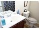 Bathroom features a single sink vanity and toilet with a patterned shower curtain at 5626 Laurel Ridge Dr, Atlanta, GA 30344