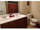 Bathroom features a double sink vanity and toilet with a patterned shower curtain at 5626 Laurel Ridge Dr, Atlanta, GA 30344