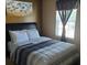 Comfortable bedroom with a queen-sized bed, white pillows, and natural light at 5626 Laurel Ridge Dr, Atlanta, GA 30344