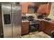Well-equipped kitchen featuring stainless steel appliances, granite counters, and hardwood cabinets at 5626 Laurel Ridge Dr, Atlanta, GA 30344