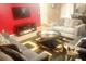 Open living room with modern furnishings, a large flat-screen TV, area rug, and a contemporary design at 5626 Laurel Ridge Dr, Atlanta, GA 30344