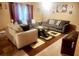 Comfortable living room with neutral colors, multiple couches, decorative artwork, and a patterned rug at 5626 Laurel Ridge Dr, Atlanta, GA 30344