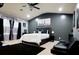 Spacious main bedroom featuring dark accents, an en-suite bath, ample light, and a ceiling fan at 5626 Laurel Ridge Dr, Atlanta, GA 30344