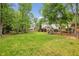 Large grassy backyard ideal for outdoor activities, complete with playground at 730 Mount Oglethorpe Trl, Alpharetta, GA 30022