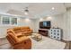 Finished basement with a sectional sofa, a large screen television, a modern ceiling fan, and recessed lighting at 730 Mount Oglethorpe Trl, Alpharetta, GA 30022
