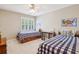 Cozy bedroom with two beds, a window, and bright interior decor at 730 Mount Oglethorpe Trl, Alpharetta, GA 30022