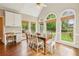 Bright breakfast nook with hardwood floors, vaulted ceilings, and large windows overlooking the backyard at 730 Mount Oglethorpe Trl, Alpharetta, GA 30022