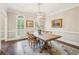 Formal dining room with hardwood floors, traditional decor, and natural light at 730 Mount Oglethorpe Trl, Alpharetta, GA 30022
