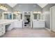 Dual vanities in a main bathroom with a view into the primary bedroom at 730 Mount Oglethorpe Trl, Alpharetta, GA 30022