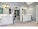 Dual vanities in a main bathroom with a view into the primary bedroom at 730 Mount Oglethorpe Trl, Alpharetta, GA 30022