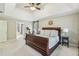 Comfortable main bedroom with a tray ceiling, large windows and an ensuite bathroom at 730 Mount Oglethorpe Trl, Alpharetta, GA 30022