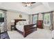 Comfortable main bedroom with a tray ceiling, large windows and an ensuite bathroom at 730 Mount Oglethorpe Trl, Alpharetta, GA 30022