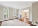 Playroom with hardwood floors, arched windows, and neutral paint at 730 Mount Oglethorpe Trl, Alpharetta, GA 30022