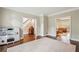 Playroom with hardwood floors, neutral paint, and view to the entry stairs and living room at 730 Mount Oglethorpe Trl, Alpharetta, GA 30022