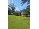 Expansive backyard showcasing a screened porch perfect for outdoor relaxation at 7562 Asbury Manor Dr, Lithonia, GA 30014