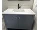 Bathroom vanity featuring a gray cabinet, white marble countertop and a sink at 7562 Asbury Manor Dr, Lithonia, GA 30014