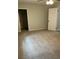Bedroom features neutral walls, carpet, and a door leading to a closet and hallway at 7562 Asbury Manor Dr, Lithonia, GA 30014