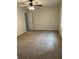 Bedroom features neutral walls, carpet, ceiling fan, and a door leading to other rooms at 7562 Asbury Manor Dr, Lithonia, GA 30014