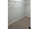 Walk-in closet featuring neutral walls, carpet, and wire shelving for ample storage at 7562 Asbury Manor Dr, Lithonia, GA 30014
