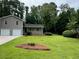 Well-maintained home with a spacious front yard and a classic architectural design at 7562 Asbury Manor Dr, Lithonia, GA 30014