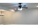 Bright living room featuring modern lighting and a neutral color palette at 7562 Asbury Manor Dr, Lithonia, GA 30014