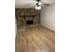 Spacious living room featuring a stone fireplace and new laminate flooring at 7562 Asbury Manor Dr, Lithonia, GA 30014
