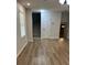 Comfortable living room with new flooring and access to stairs at 7562 Asbury Manor Dr, Lithonia, GA 30014
