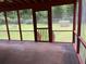 Outdoor porch featuring a screened-in view to the backyard at 7562 Asbury Manor Dr, Lithonia, GA 30014