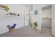 Bright room with a shelf of books and an open closet featuring shelving at 1998 Lakeview Bend Way, Buford, GA 30519