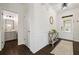 Bright entryway with hardwood floors, white trim, and view of the half-bath at 1998 Lakeview Bend Way, Buford, GA 30519