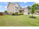 Two-story home with stone accents, a well-manicured lawn, and a shade tree at 1998 Lakeview Bend Way, Buford, GA 30519