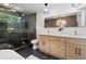 Bathroom with a modern shower, double vanity, and stylish light fixtures at 2001 Swazey Dr, Decatur, GA 30032