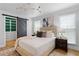 Spacious bedroom with a sliding barn door leads to walk-in closet at 2001 Swazey Dr, Decatur, GA 30032