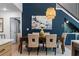 Elegant dining room with stylish light fixture, table set and decorative wall art at 2001 Swazey Dr, Decatur, GA 30032